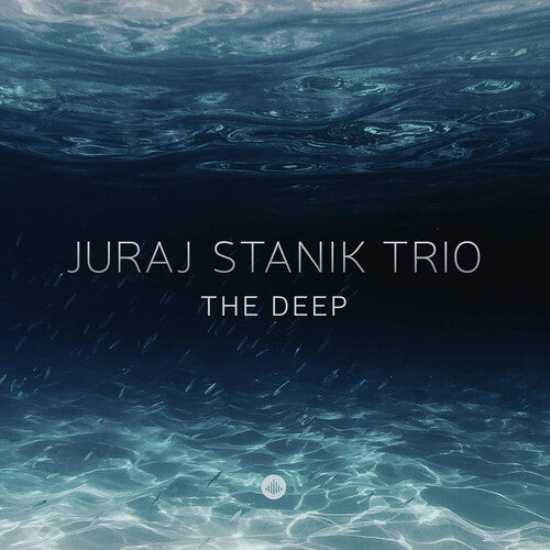 Stanik, Juraj: The Deep (Vinyl LP). The Deep' - brings a surprise. It's mostly about the tone of a number of the ballads on it, adding something romantic to his approach, with a gratifying affinity for melody that still feels safe in his own very personal interpretation. And always with that swing. Intelligent but never intellectual, with no pretentious pathos and none of that 'you just gotta listen to this!' feel. In a nutshell, pure.. 